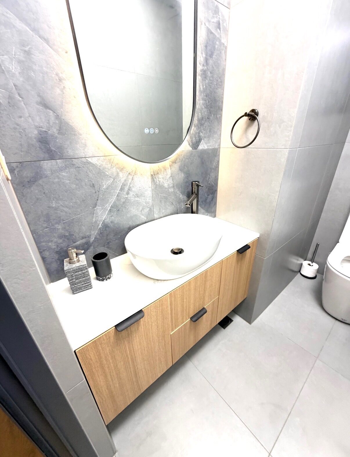 Bathroom vanity with stone benchtop and backlit mirror, Auckland
