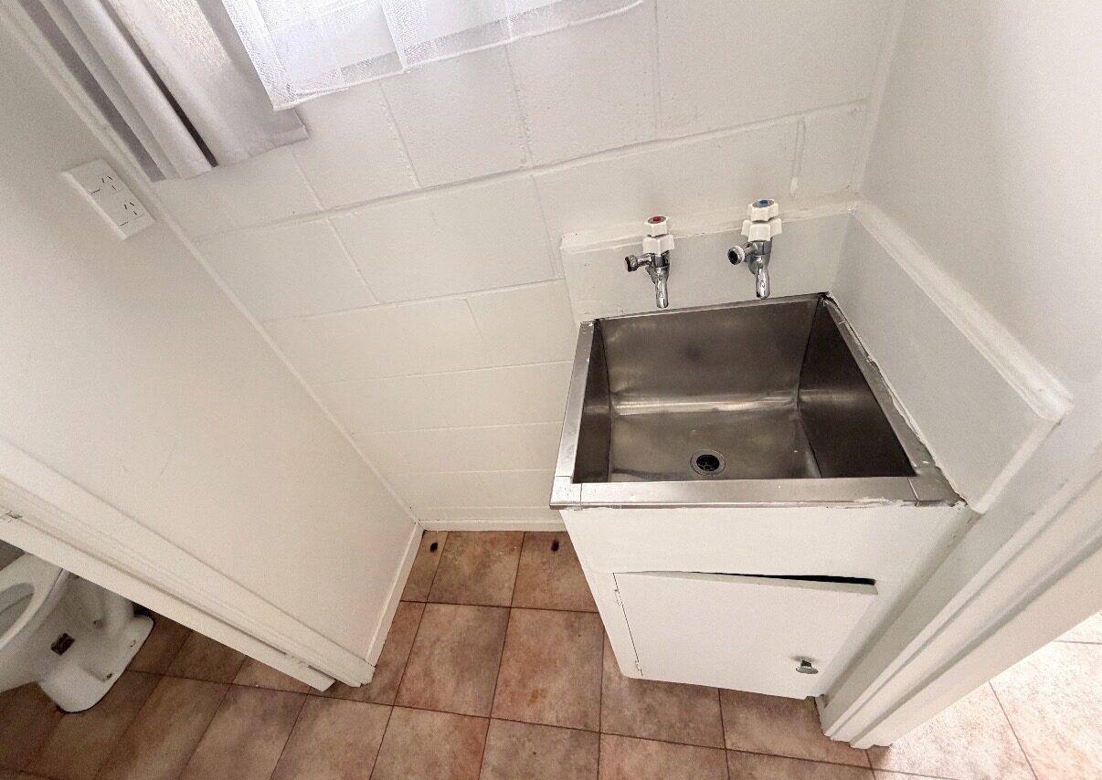 Laundry before renovation, Auckland
