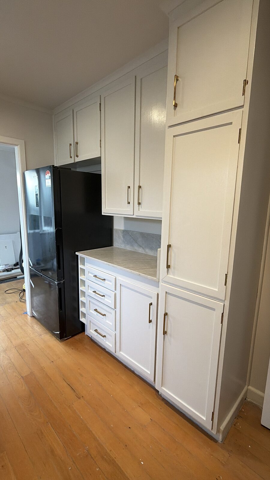 Kitchen pantry and storage wall after renovation, Auckland
